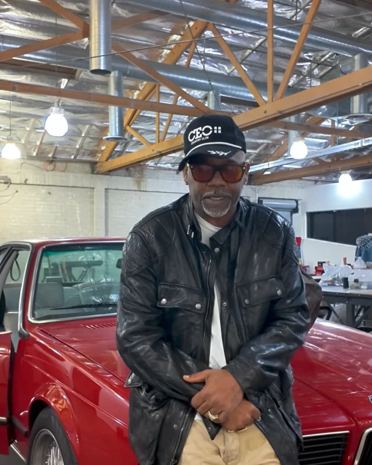 Damon Dash in the CEO Country Club trucker hat, wide shot